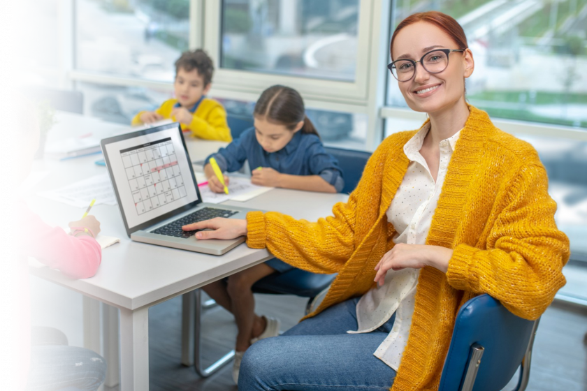 Teacher using digital tools to assess student learning and track progress in class